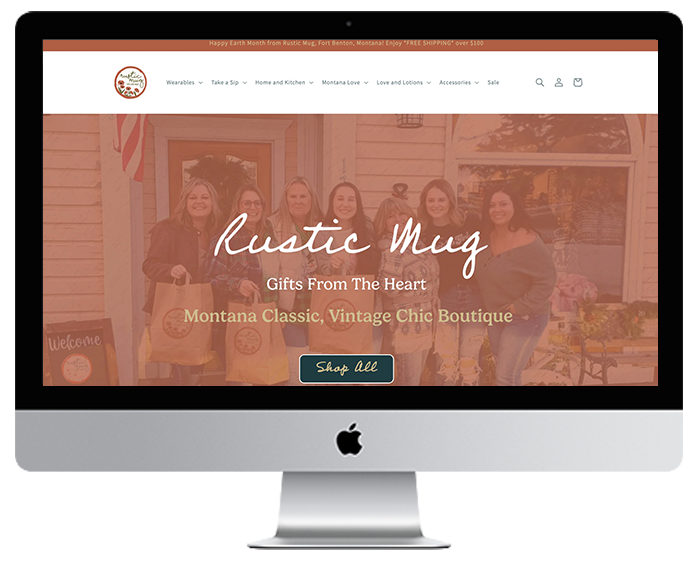 iMac computer screen showing RusticMugMt.com home page design and copy