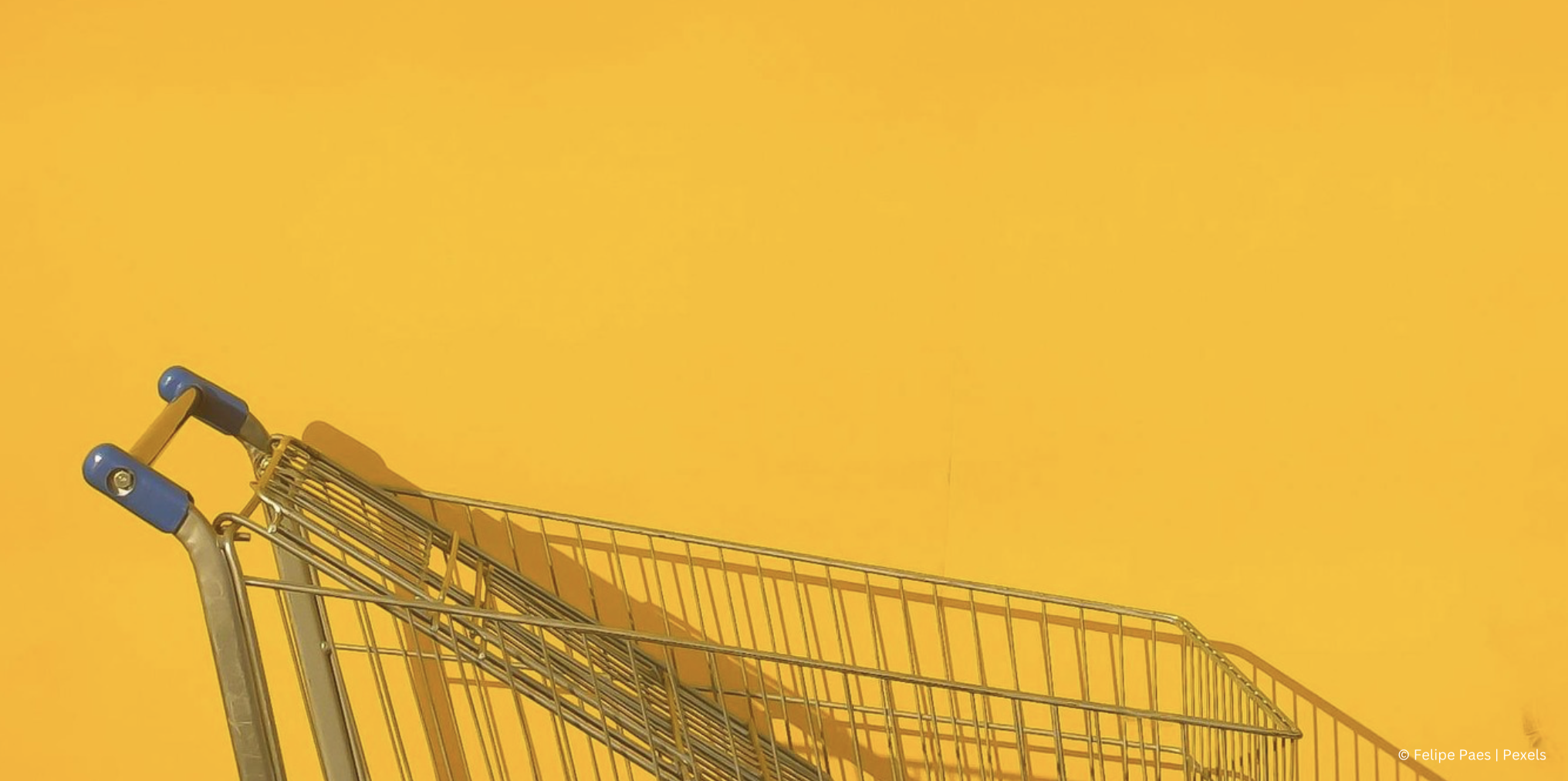 blog image shopping cart retail shopping cart against a yellow background